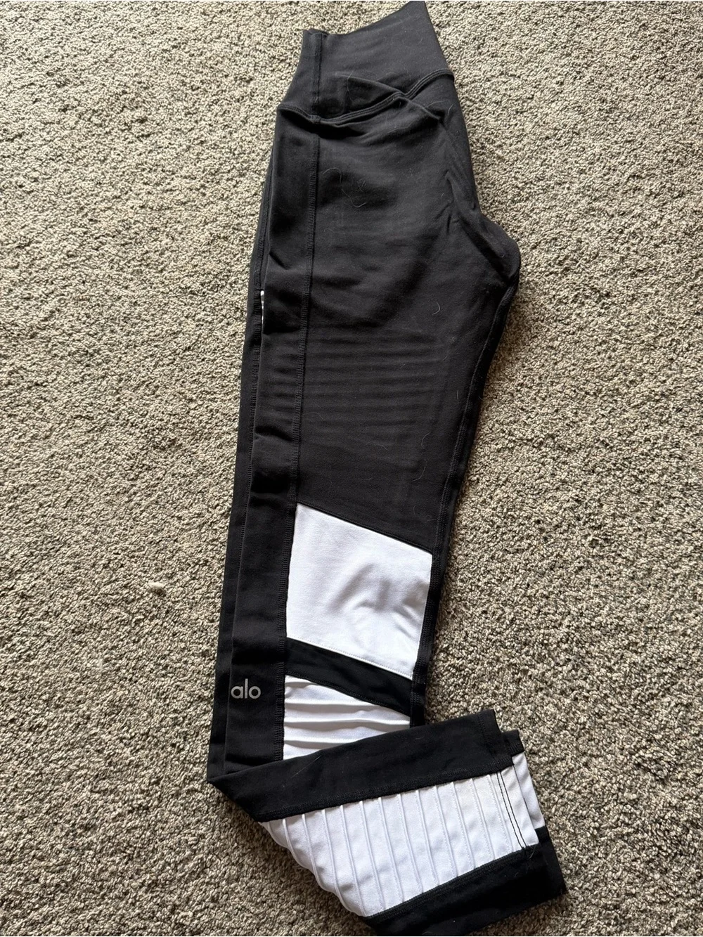 ALO Yoga Moto Leggings in a black and white